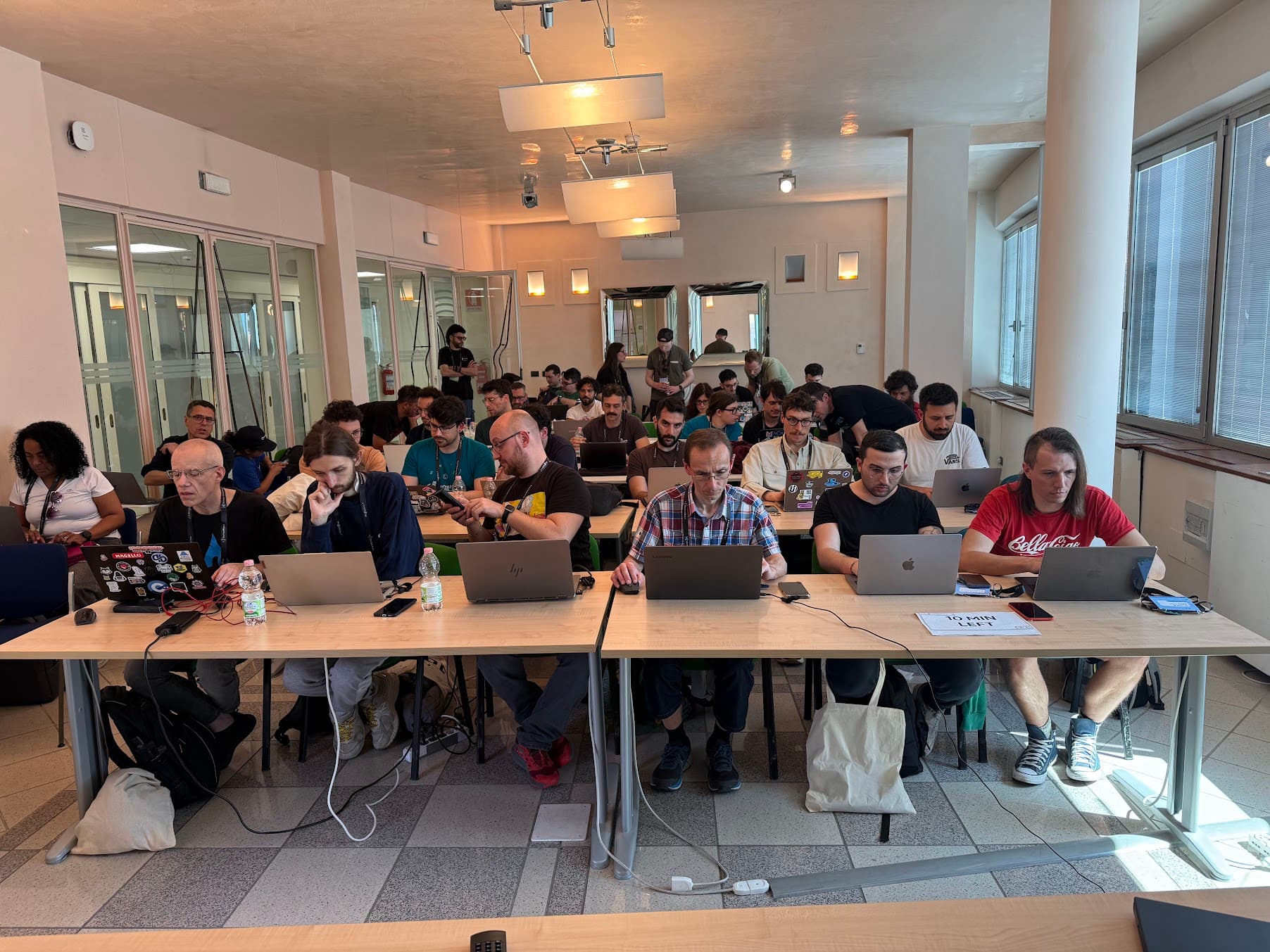 Large lecture hall filled with engaged developers